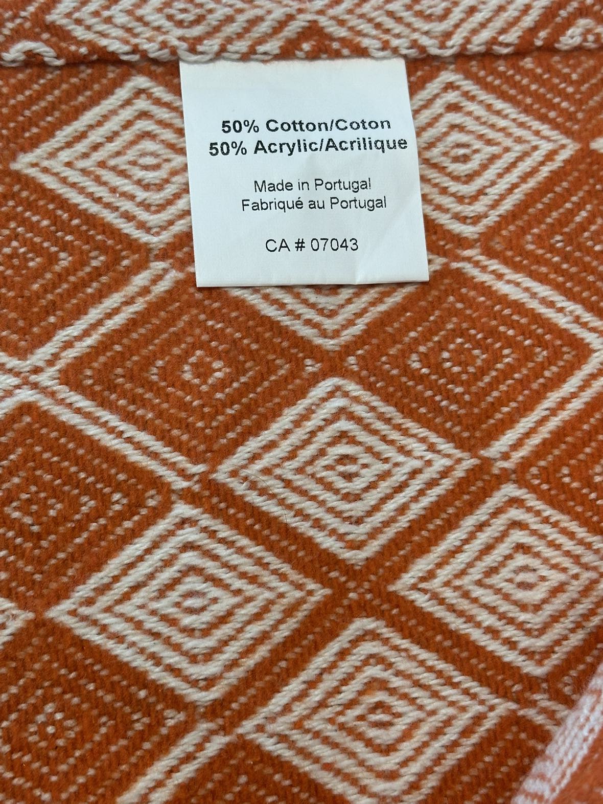 Woven patterned throw blanket • orange and cream image indicator(4)