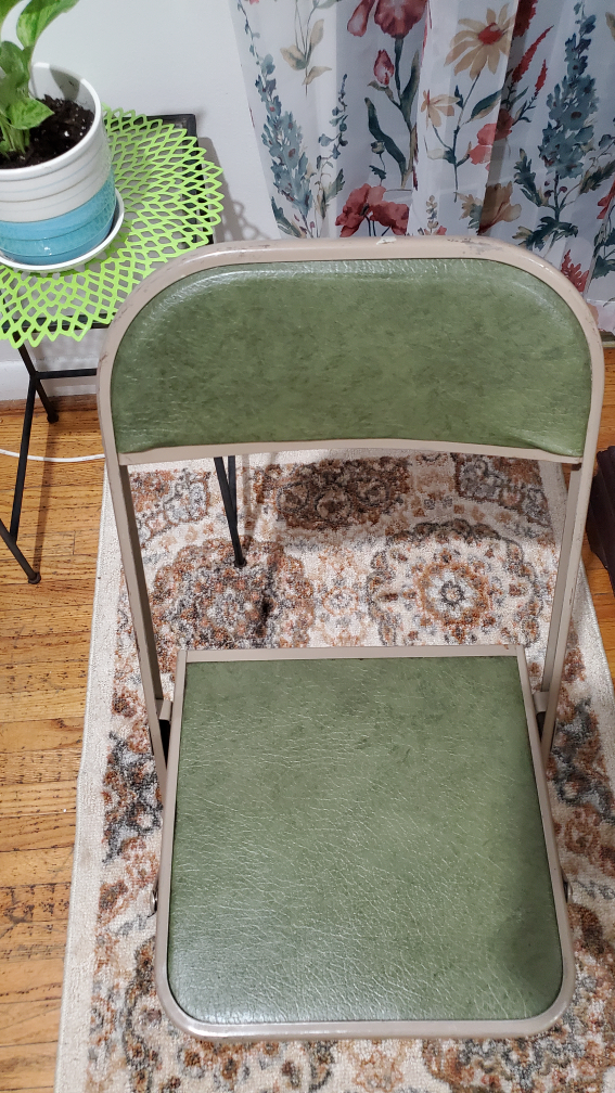 Two solid metal chairs