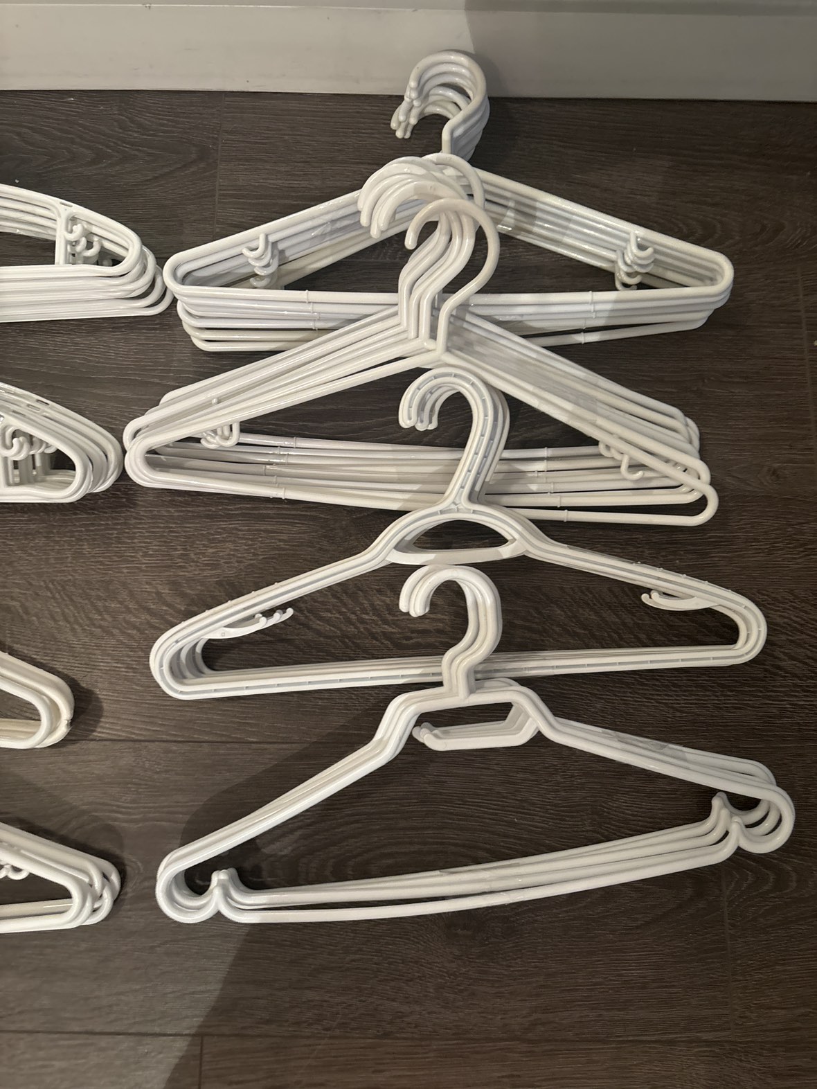 60 x White Plastic Clothing hangers thumbnail