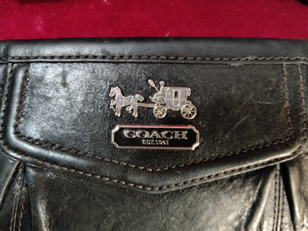 Coach wristlet, black leather exterior. image indicator(3)