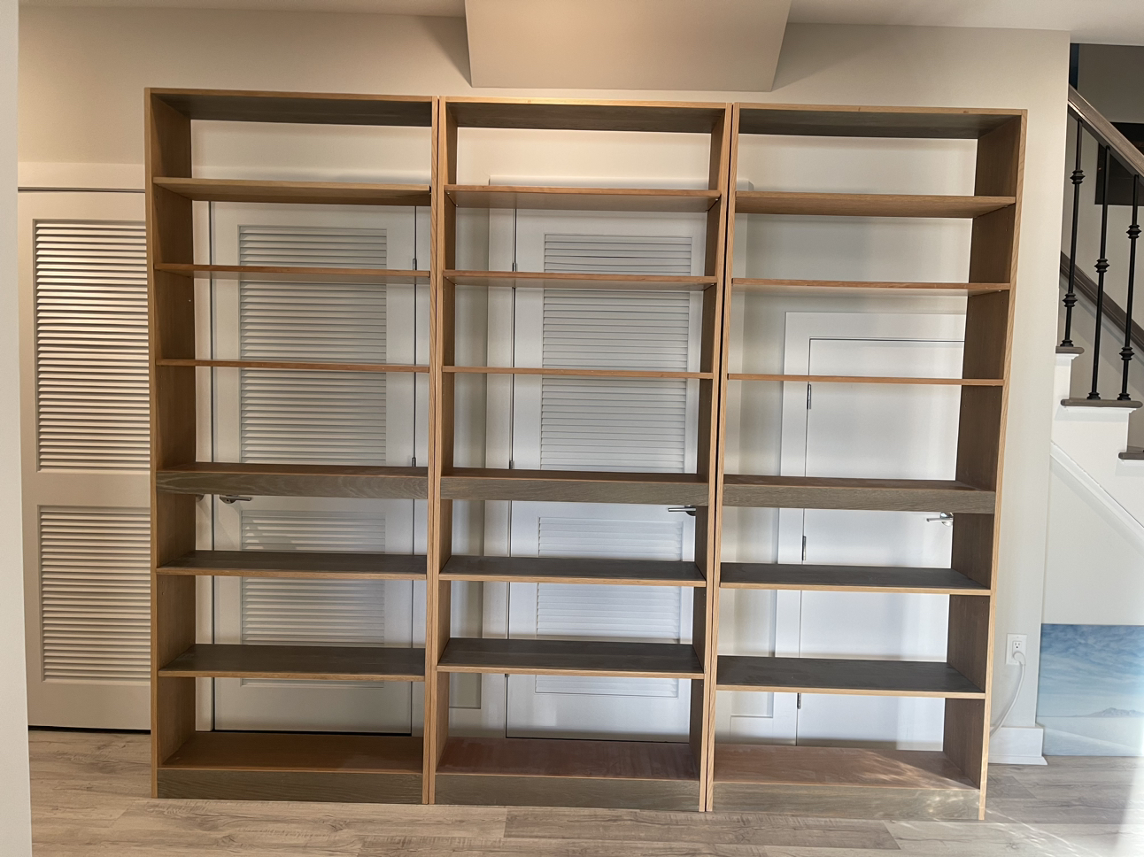 3 wooden bookcases