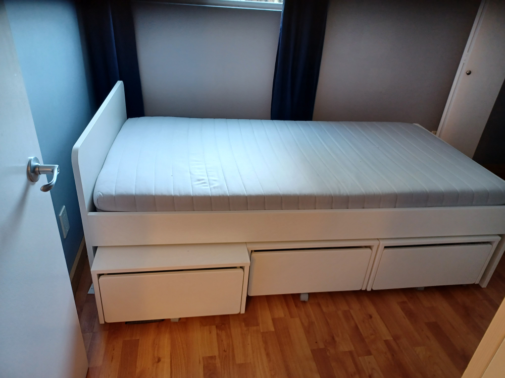white Ikea Malm single bed with three drawers