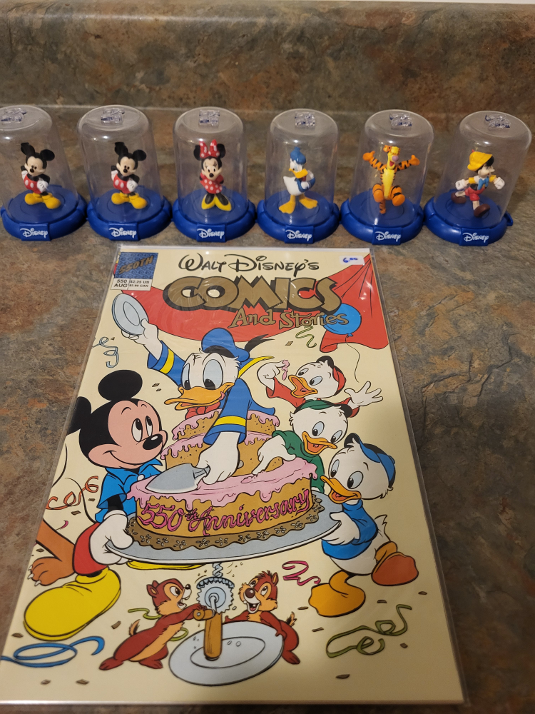 Walt Disney  toy figures and Walt Disney  comic. thumbnail