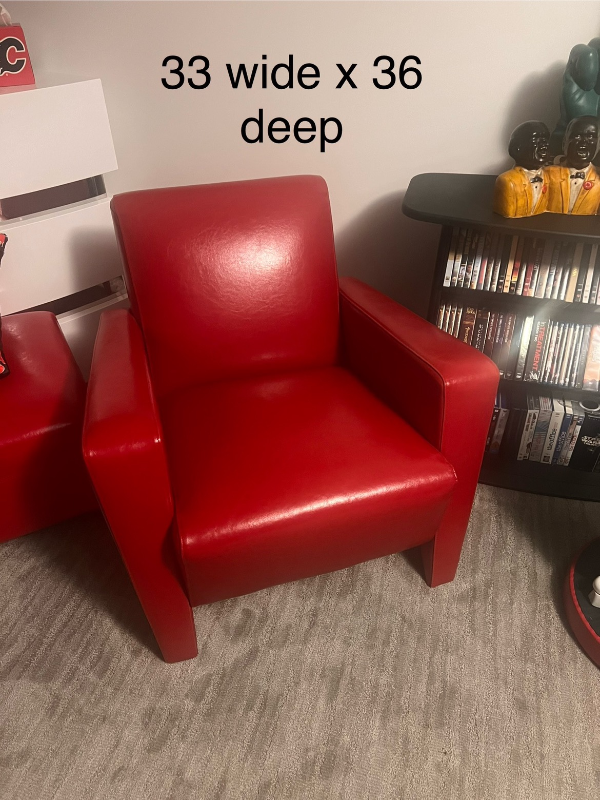 Two red leather occasional accent chairs