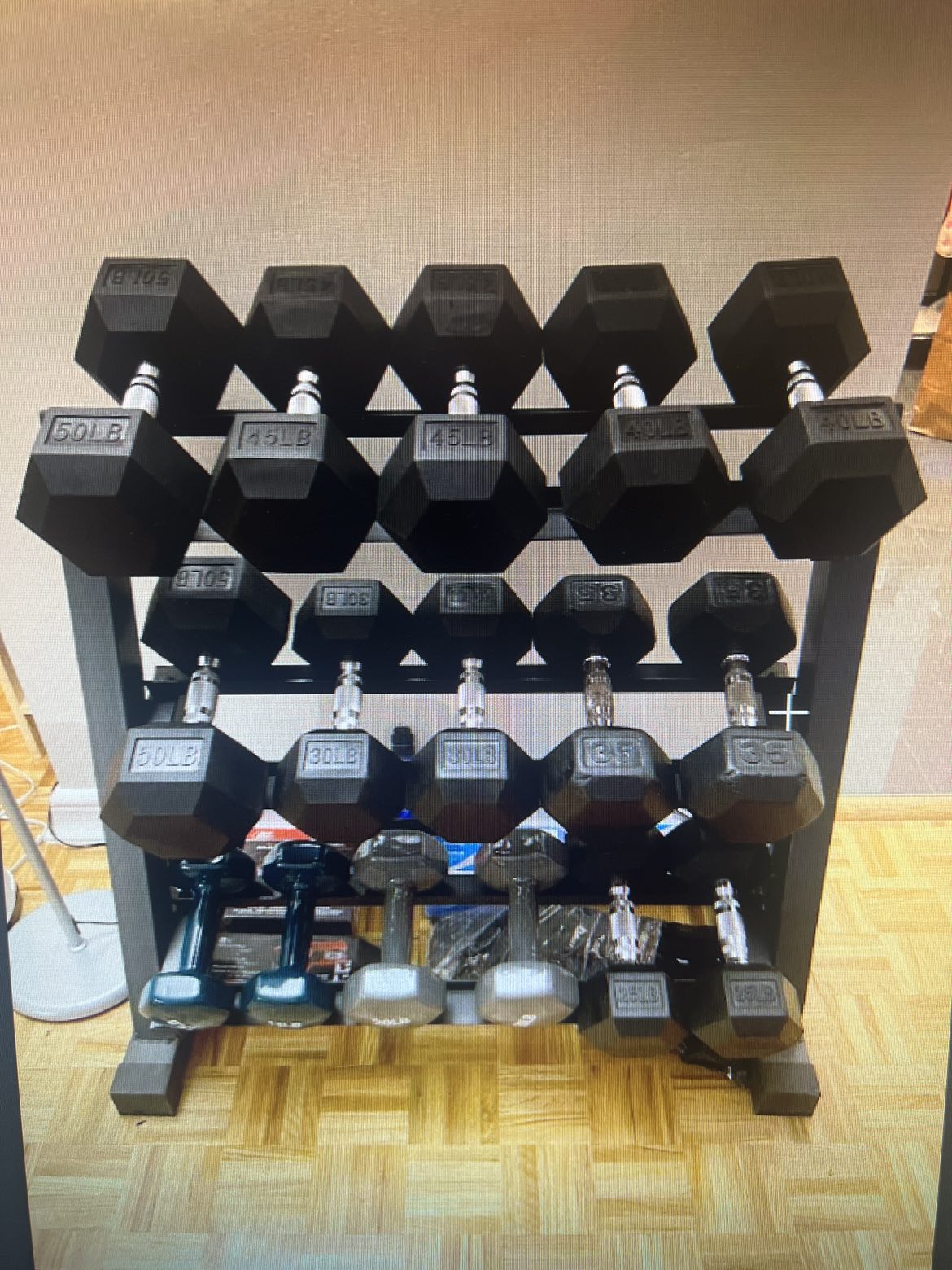 Dumbbell rack with rubber encased hex dumbbells