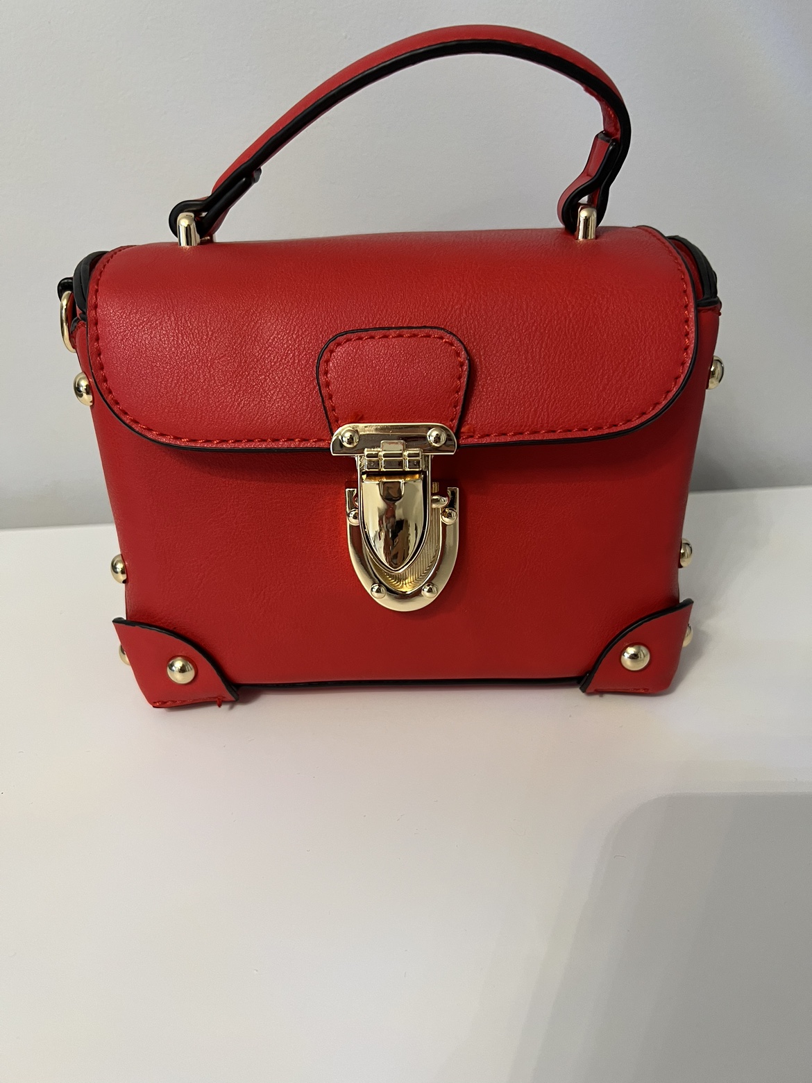 Small red with gold hardware purse