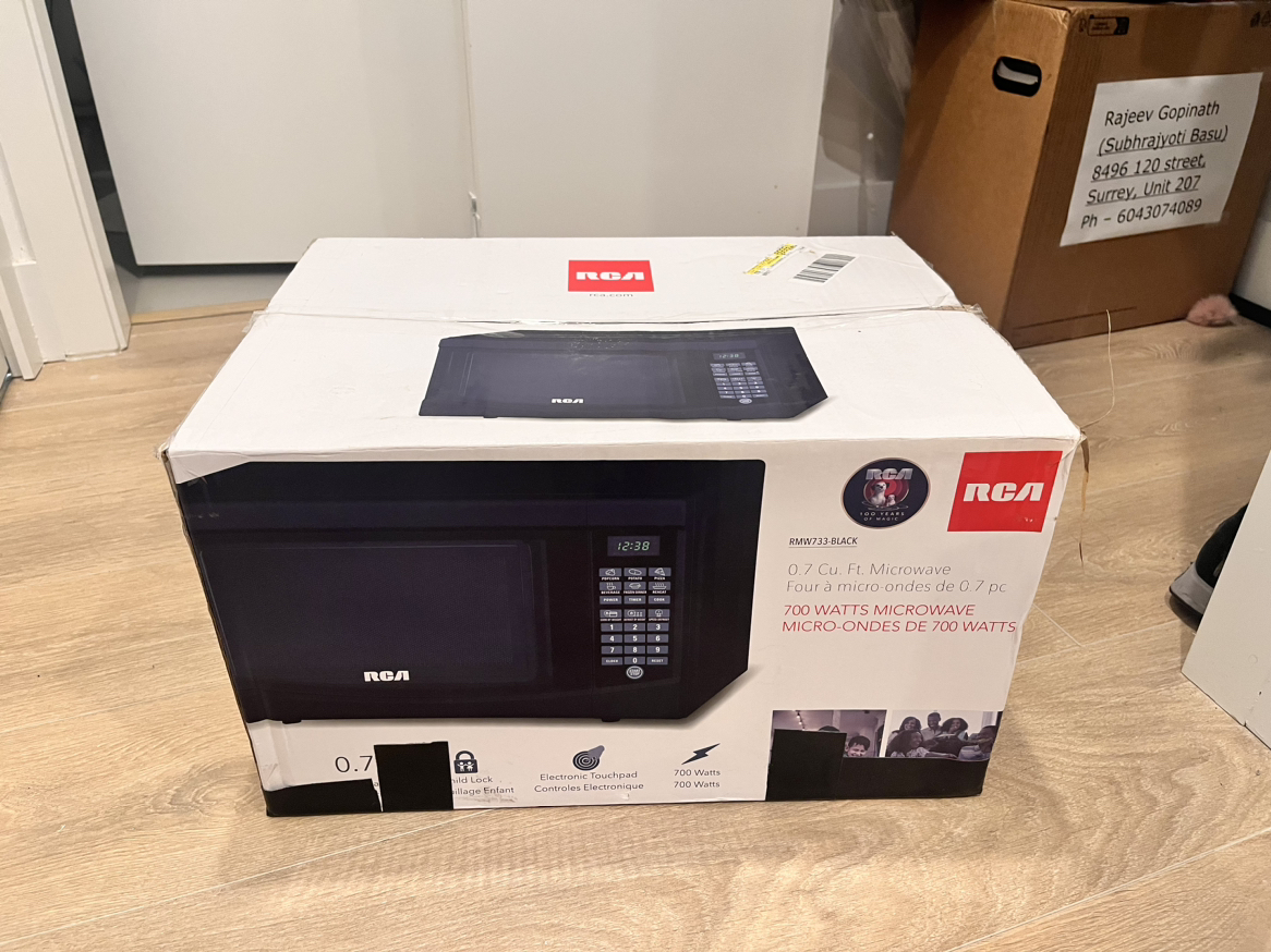 NEW counter-top RCA Microwave 700W 0.7cu.ft. - photo 5