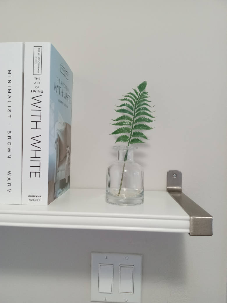 Small glass bottle with plant thumbnail