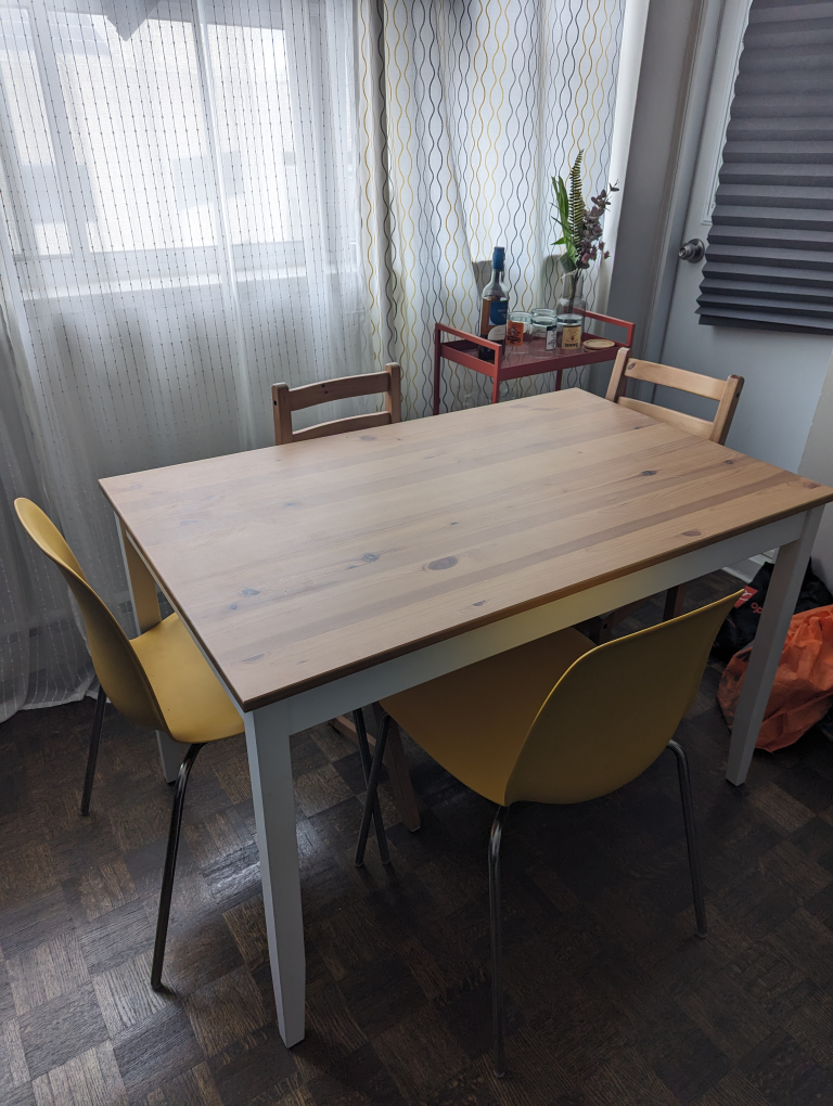 dining table with two yellow chairs