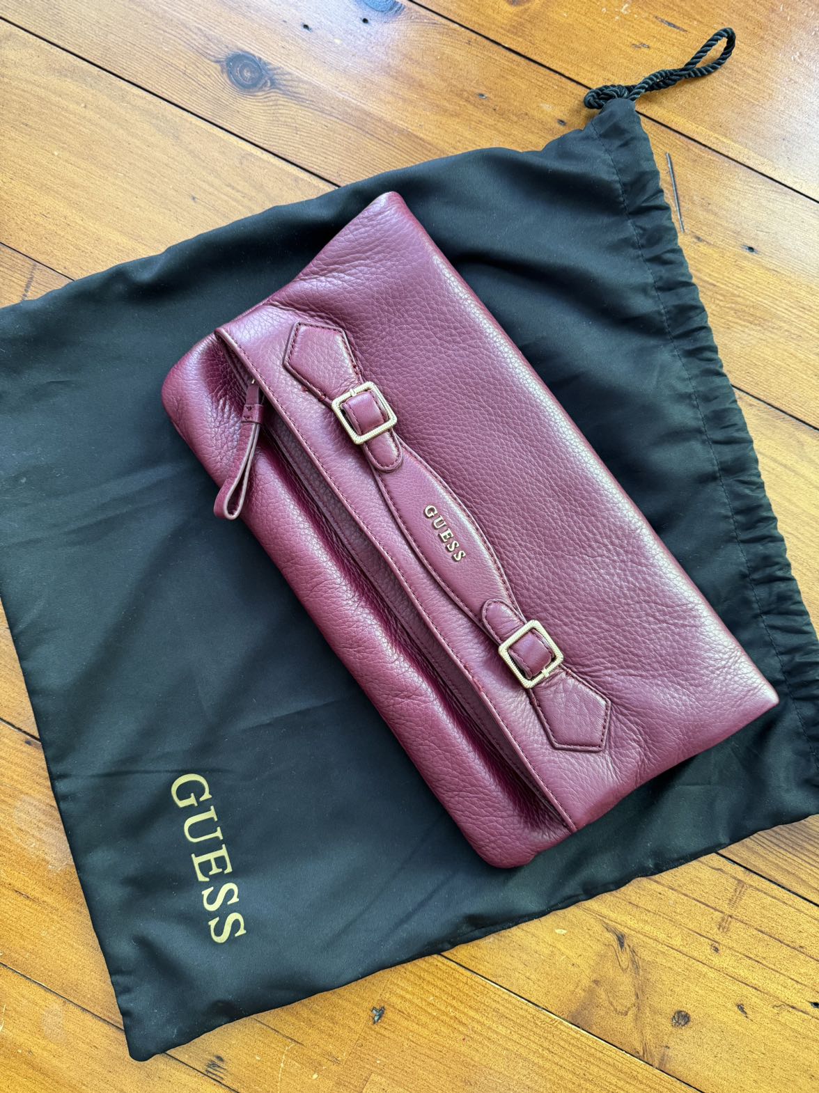 Clutch by Guess. thumbnail