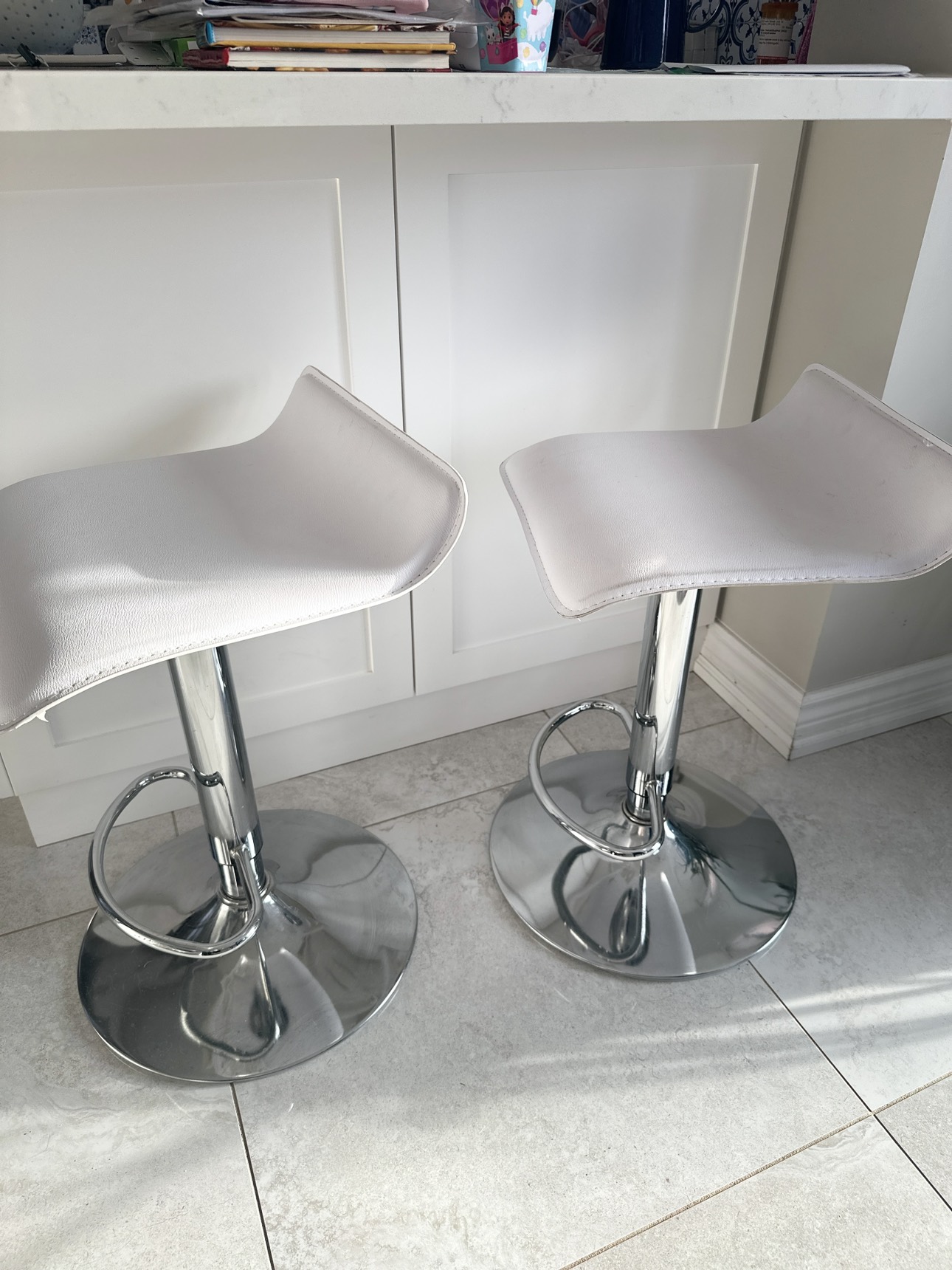 2 white bar stools