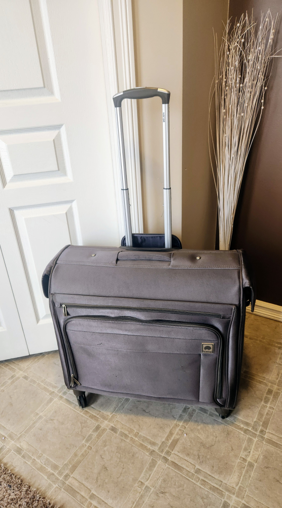 Delsey Paris Brown garment bag spinner