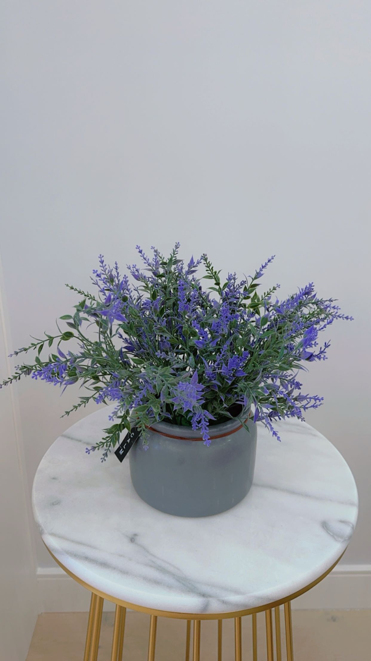 Purple artificial flowers with ceramic vase thumbnail