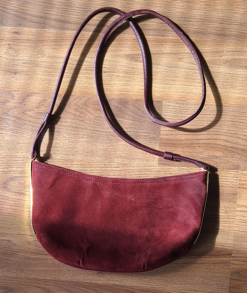 Vintage red suede handbag with gold accents