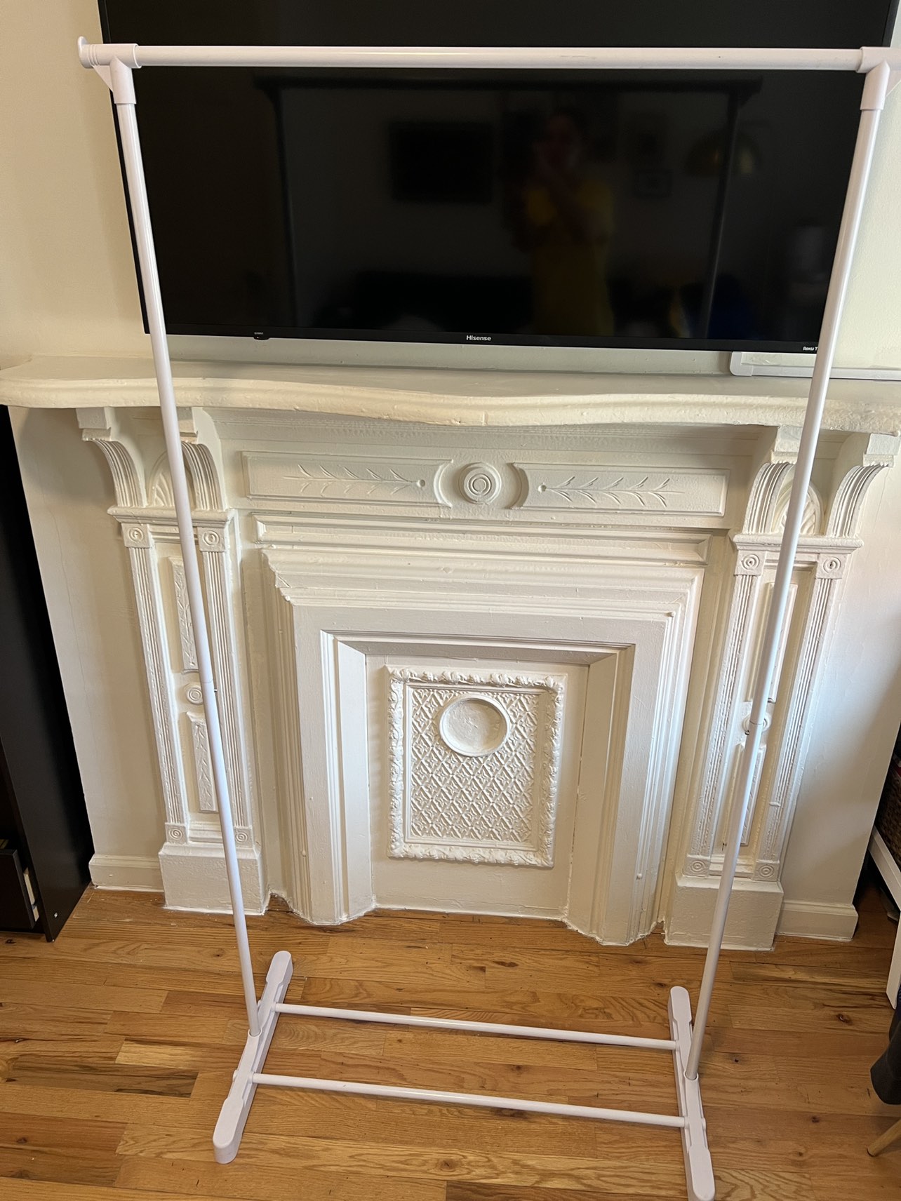 White metal garment rack