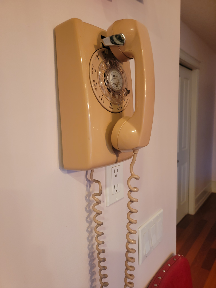 pink rotary wall mount phone