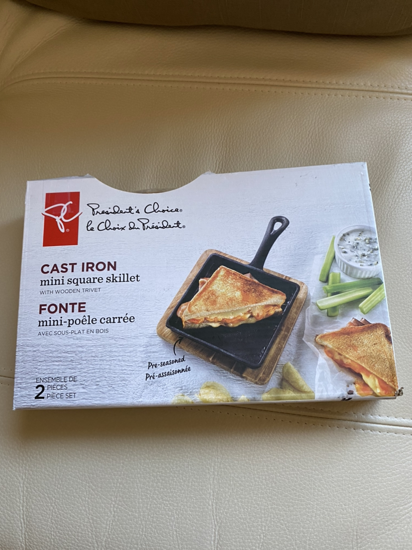 Cast iron mini skillet pan with wooden trivet thumbnail