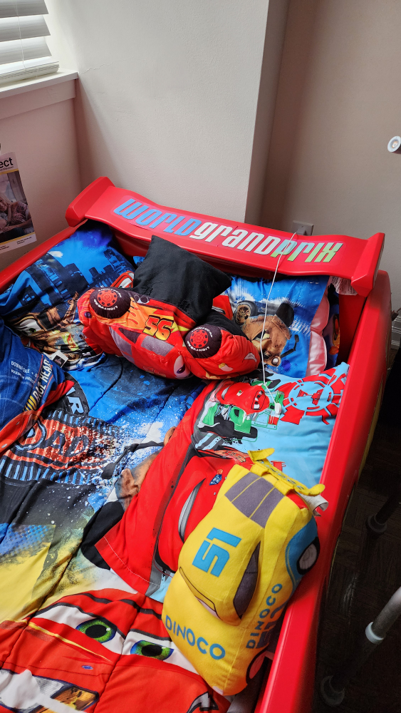 Plastic kids car bed with mattress, sheets, and car pillows - photo 2