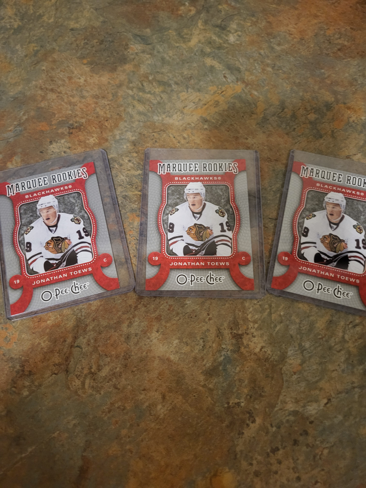 Jonathan  toews.3 Rookie  cards at 8 dollars thumbnail