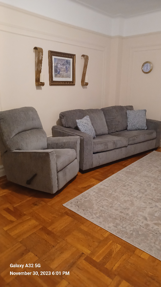 Ashley Sofa Queen sleeper with Rocker Recliner - photo 2