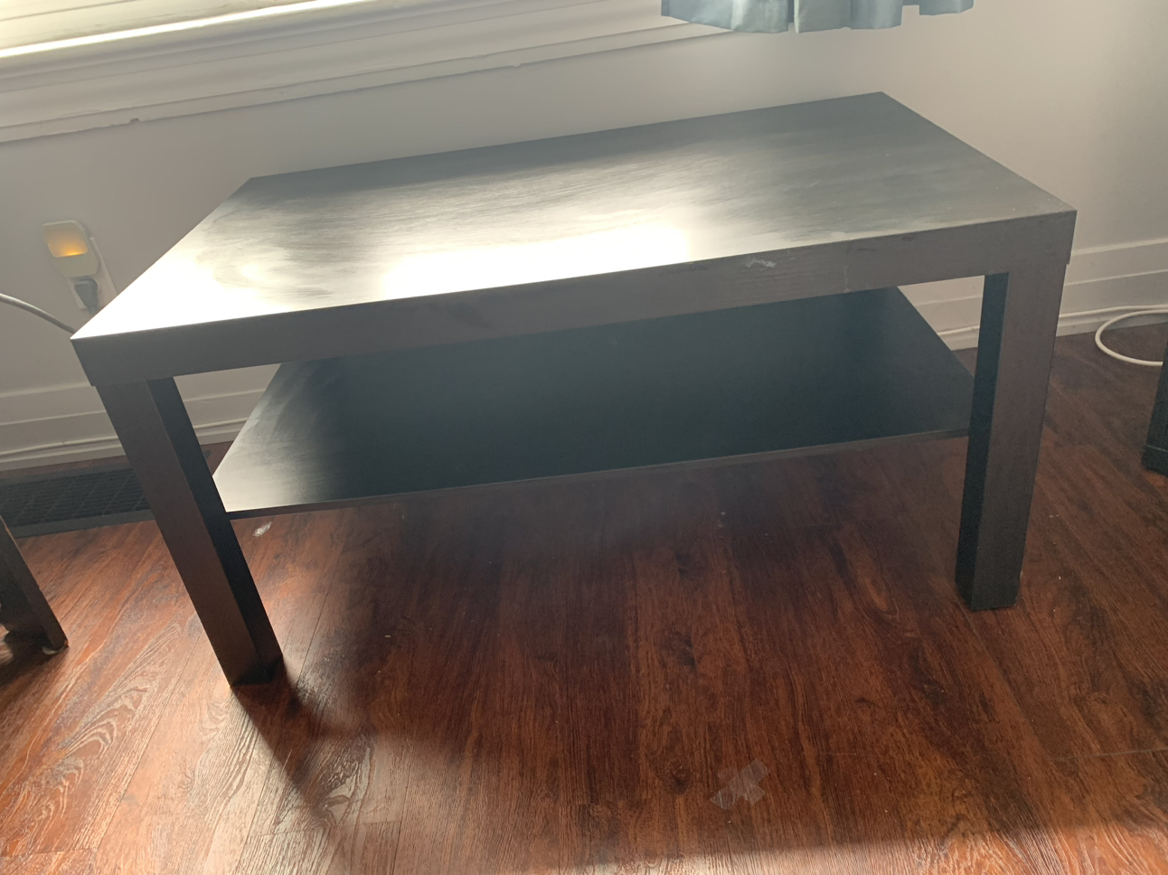 Coffee table with lower shelf