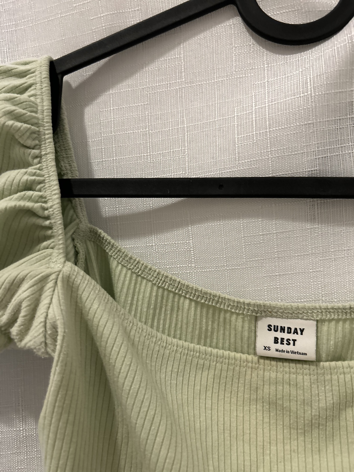 Aritzia: Sunday Best sage green ruffled crop top thumbnail