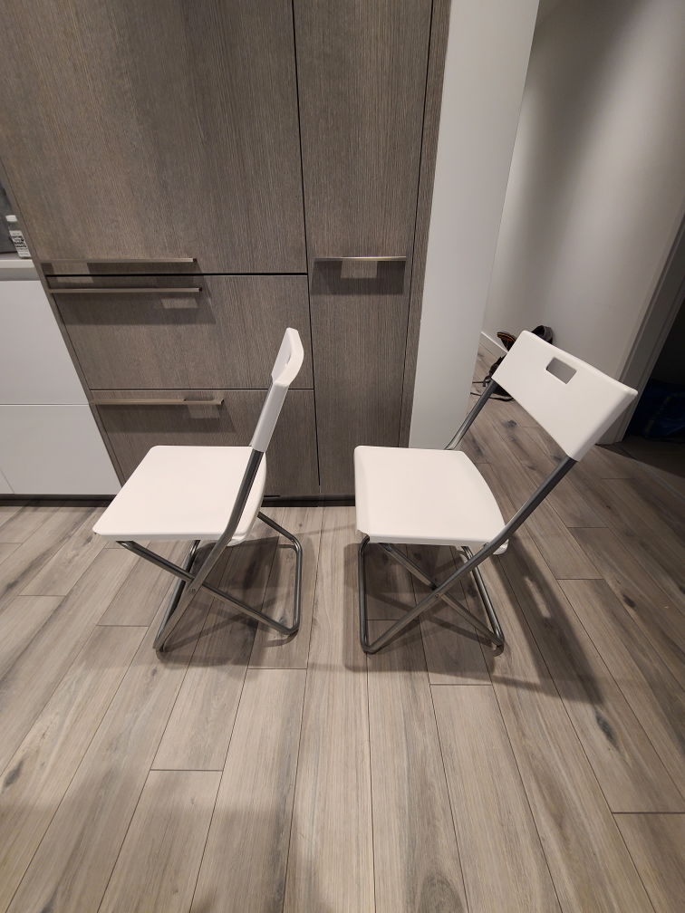 white Ikea plastic folding chairs. - photo 2