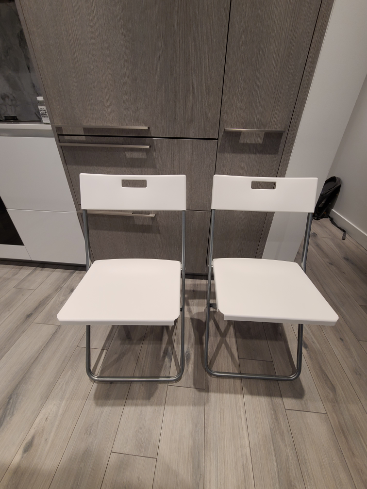 white Ikea plastic folding chairs. - photo 3