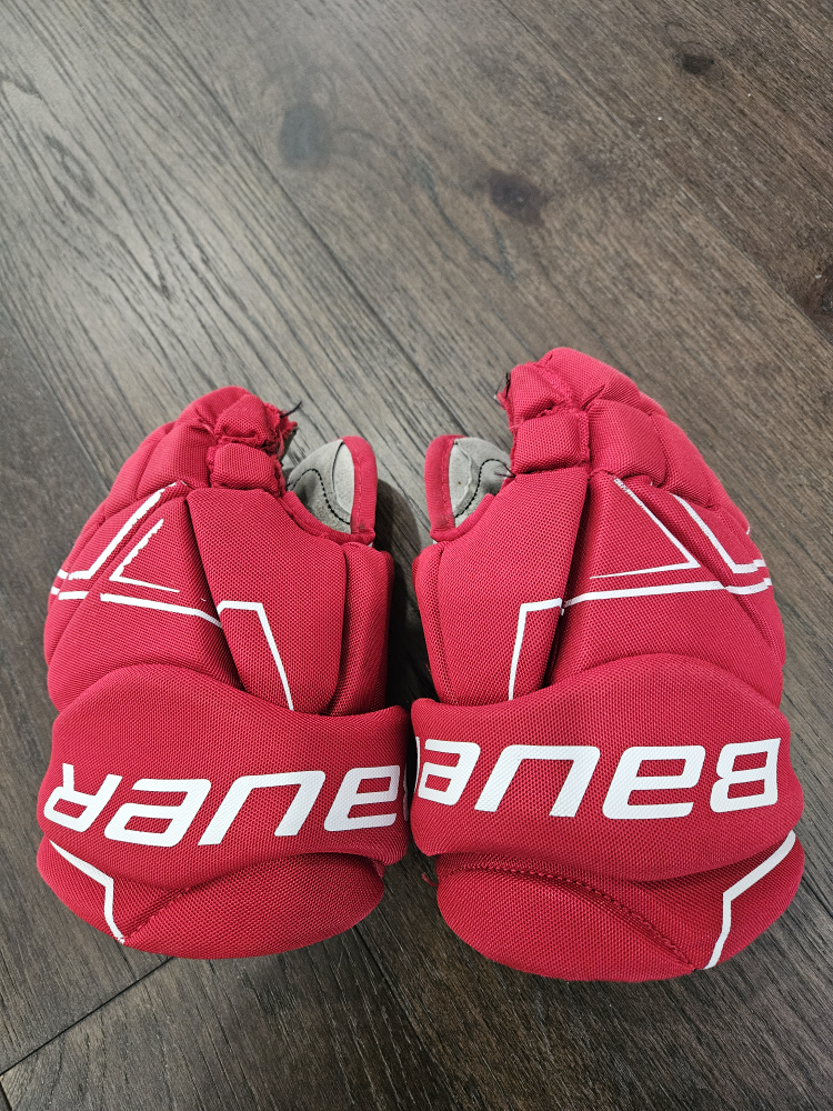 Junior size 11" (27cm) red hockey gloves. thumbnail
