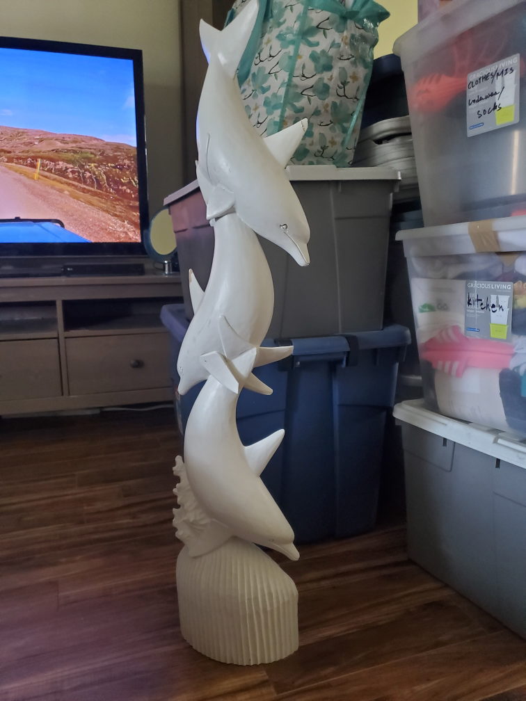 ceramic dolphin statue