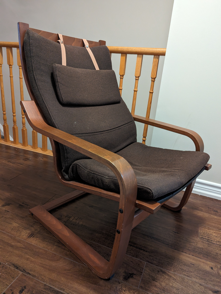 Lounge arm chair with solid wood frame and cushion.