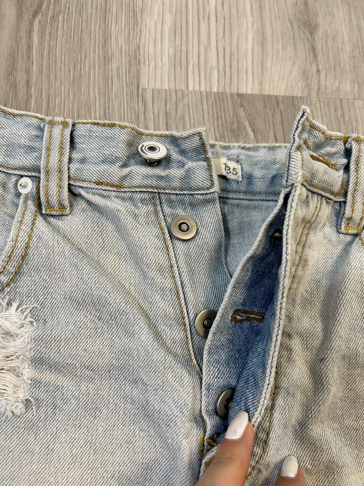 Light blue distressed denim shorts image indicator(2)