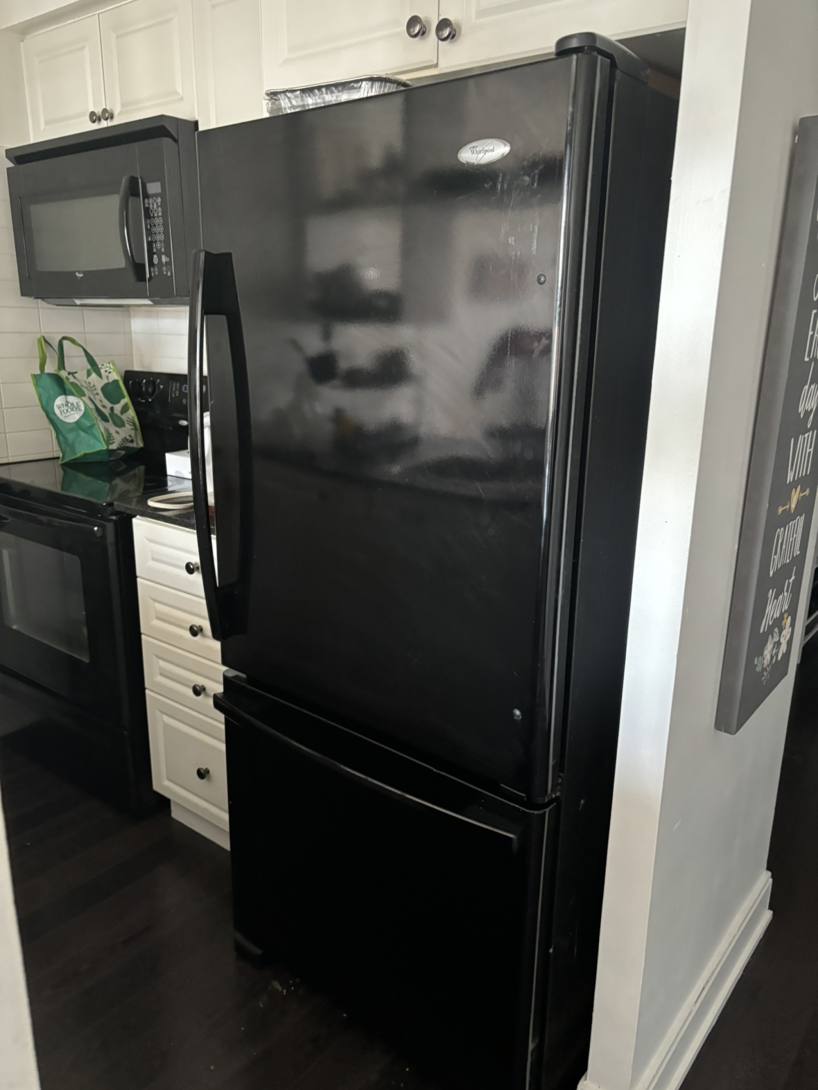 Black Whirlpool fridge 65’H x 29’W x 32.5’D inches