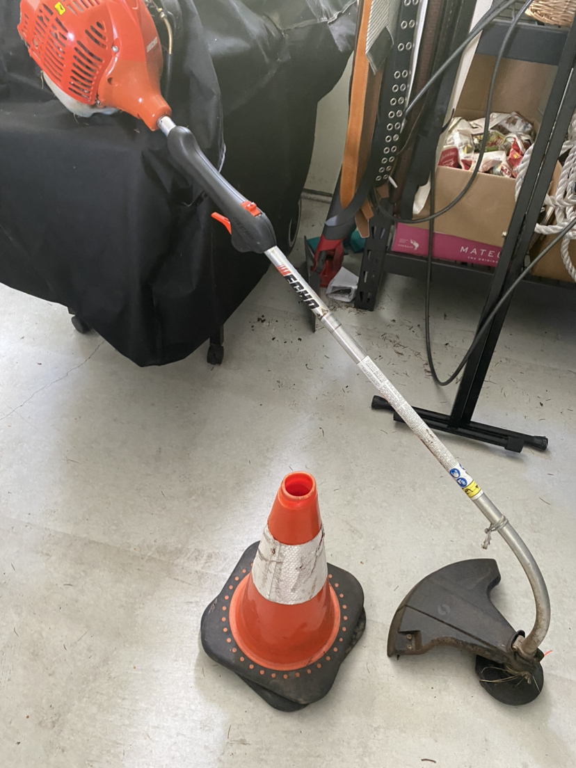 Mixed gas weed wacker and 2 pylons