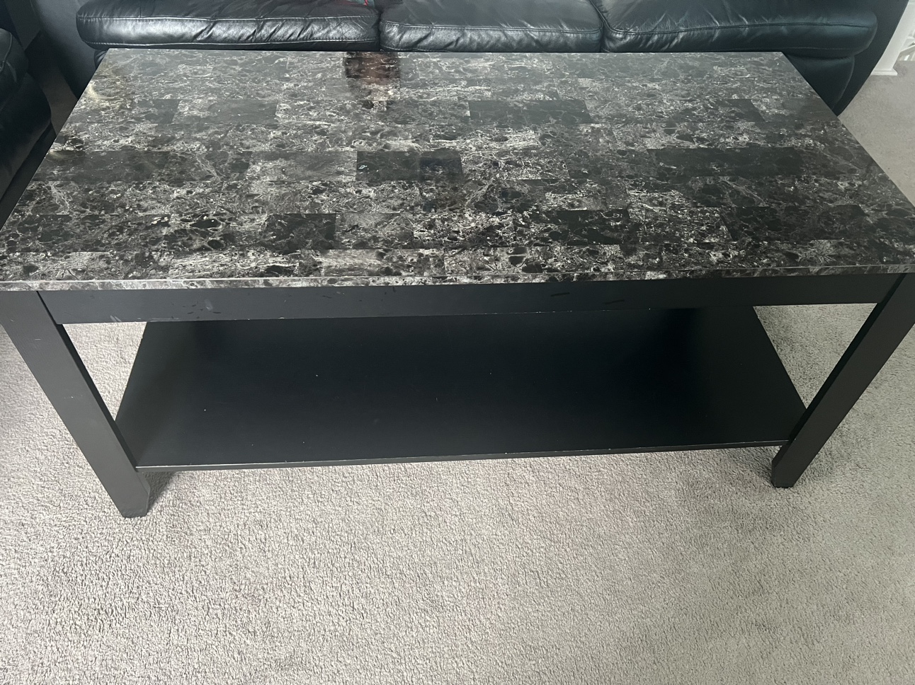 5 Seaters black sofa and table.
