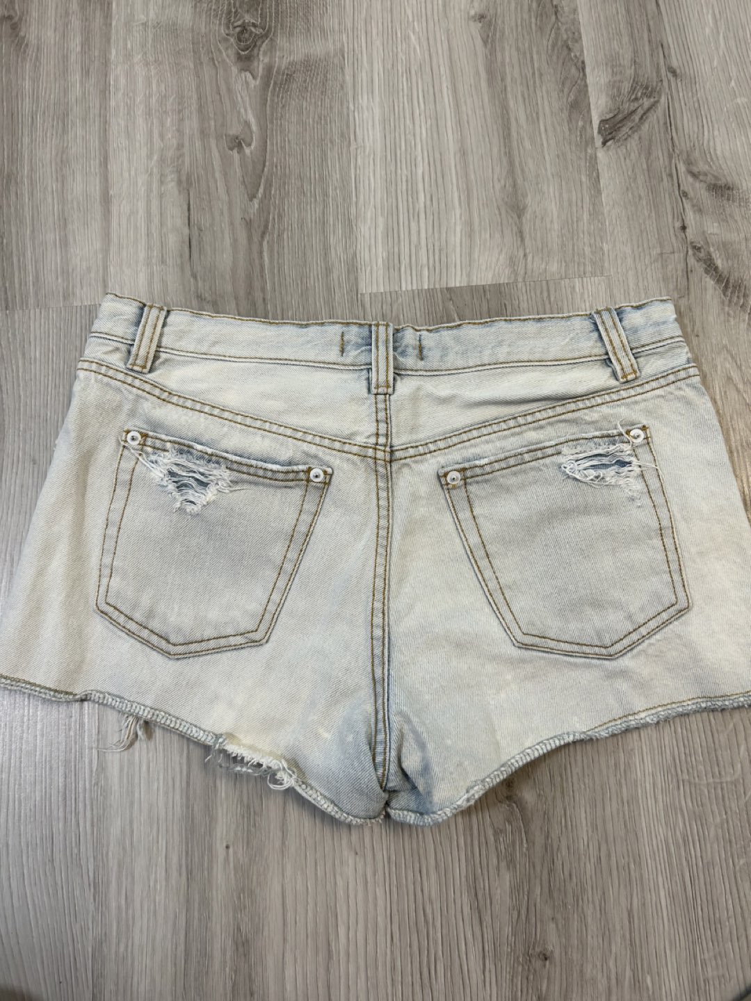 Light blue distressed denim shorts image indicator(4)