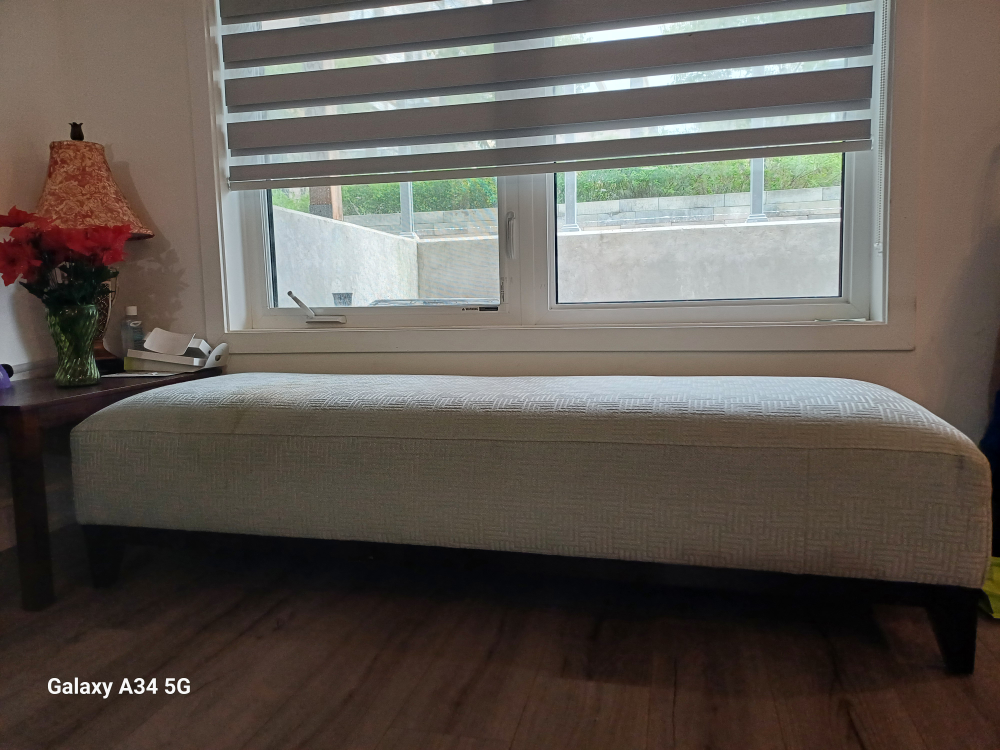 sofa bed with towel to cover