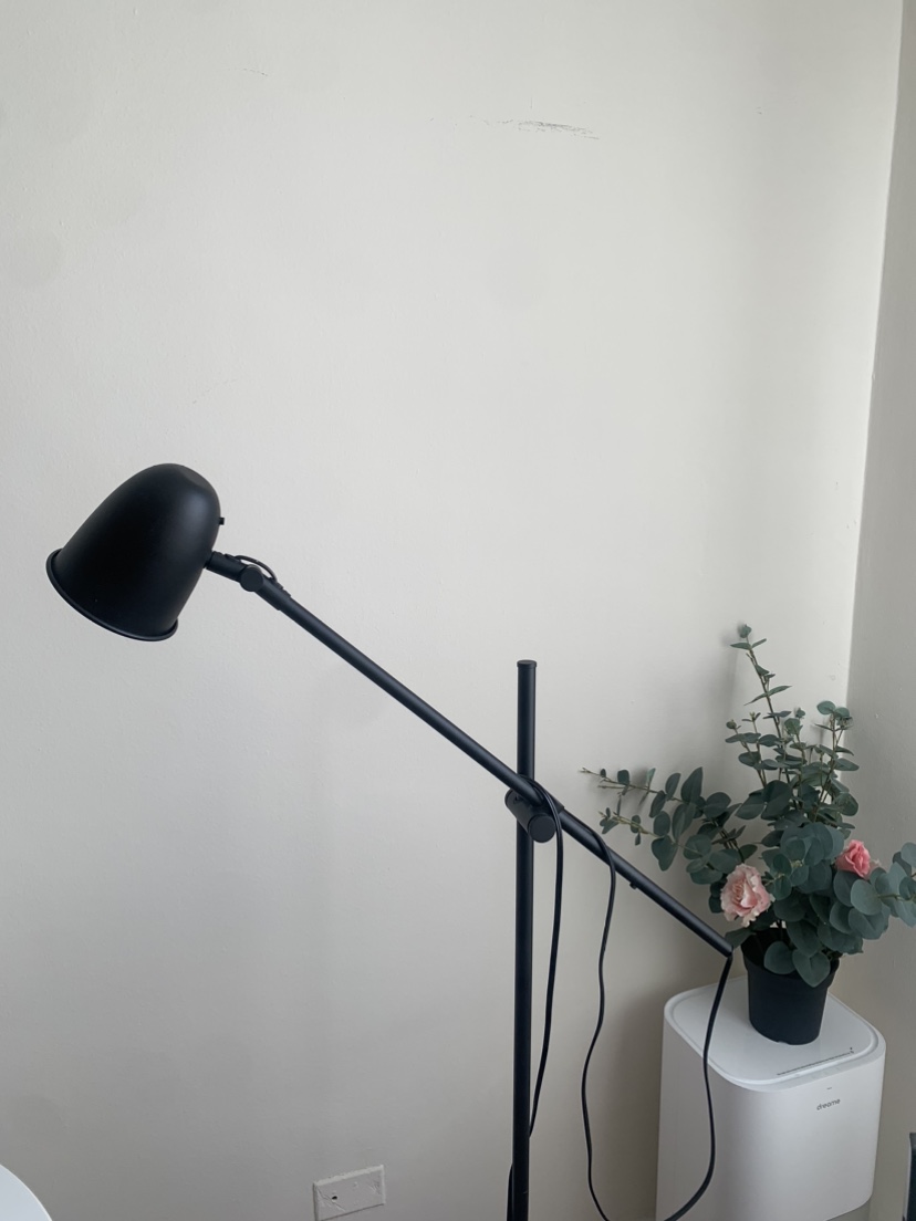Adjustable floor reading lamp with a bulb