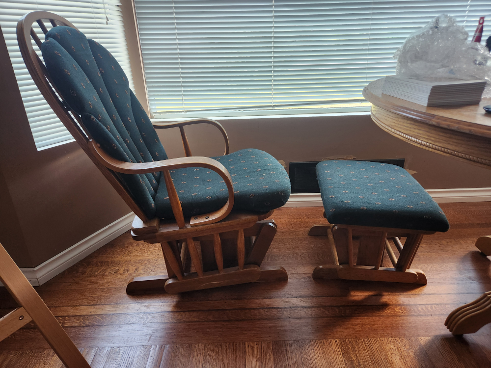 Green rocking chair with leg support