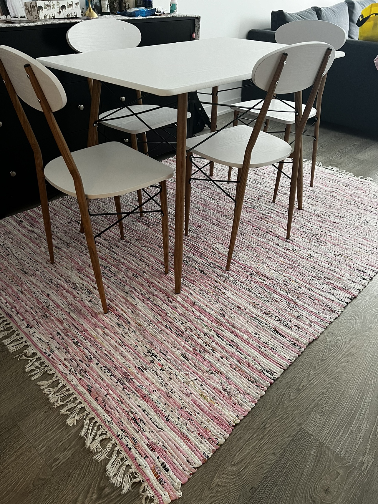Dining table with chairs and rug