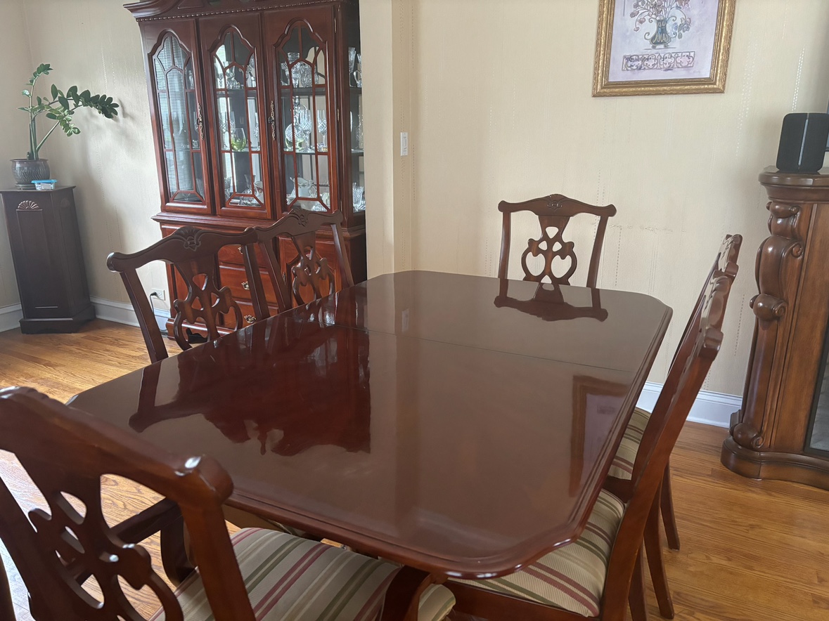 Wood Table and 6 dining chairs along with Hutch.