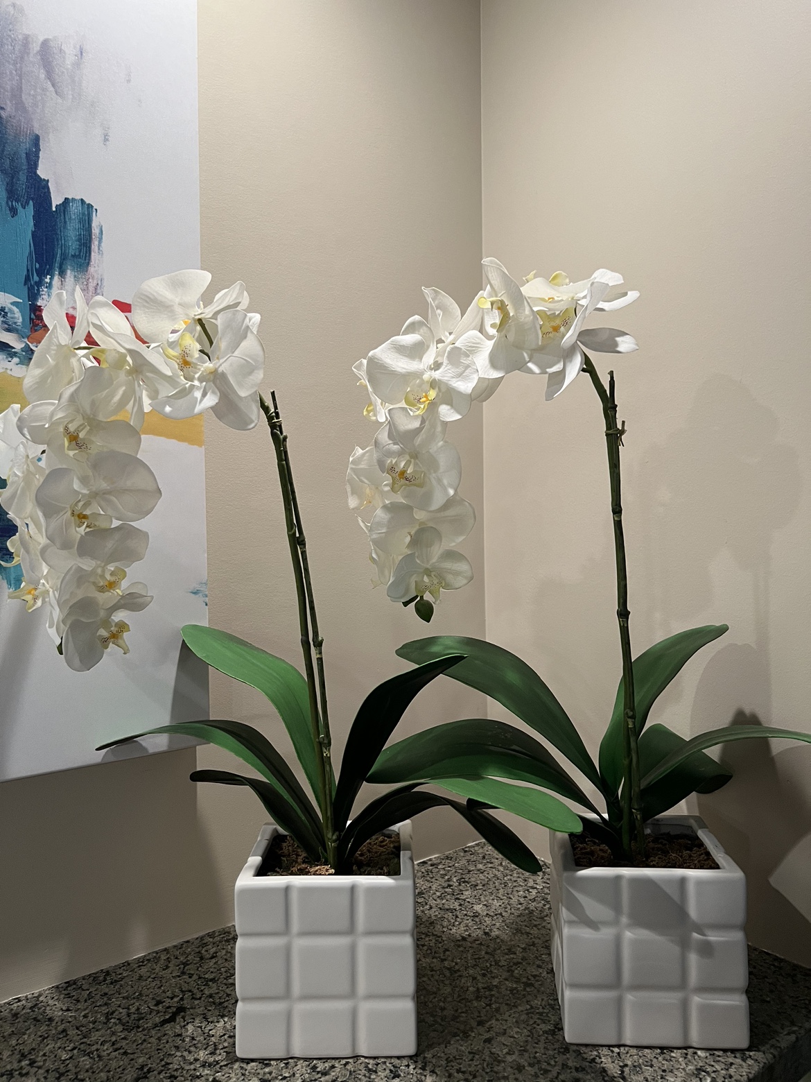2 Artificial Orchids in a white ceramic pot thumbnail