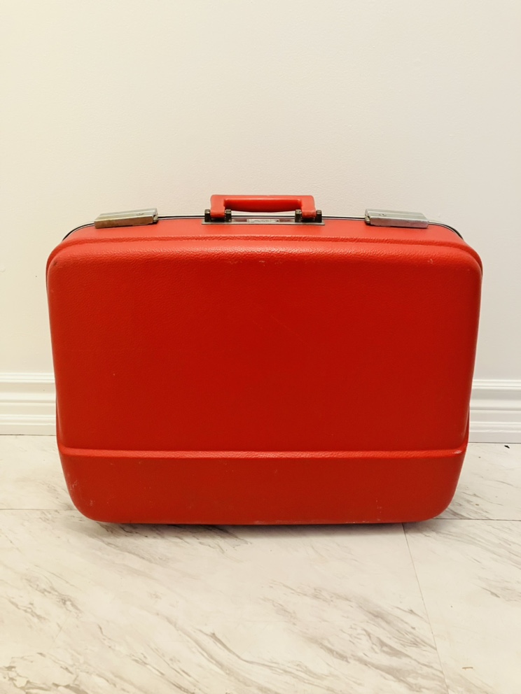 Vintage 1970s suitcase in classic red