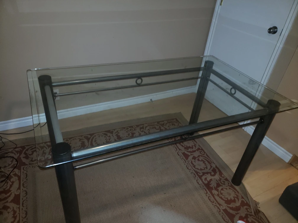 glass table with set of chairs