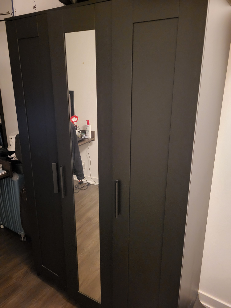 Black closet with Cabinet space
