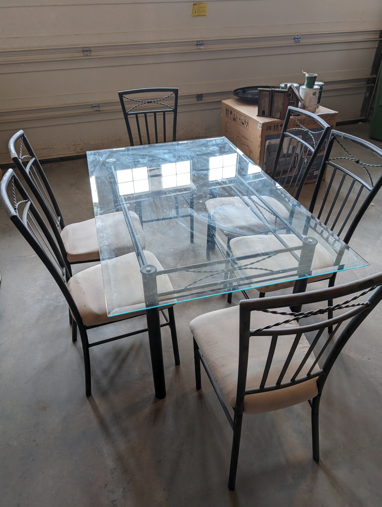 Glass top table and 6 chairs