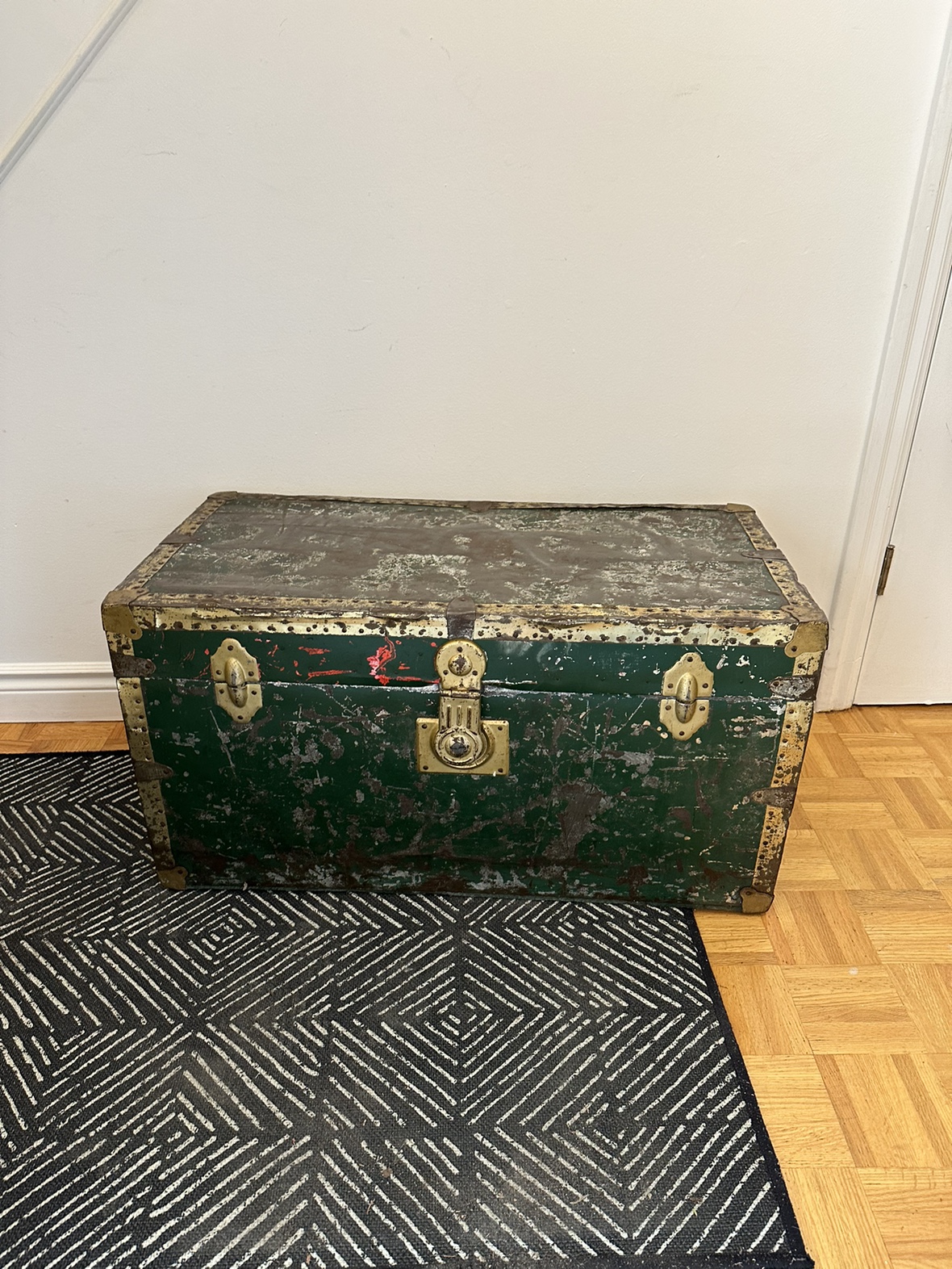 Vintage green metal steamer trunk
