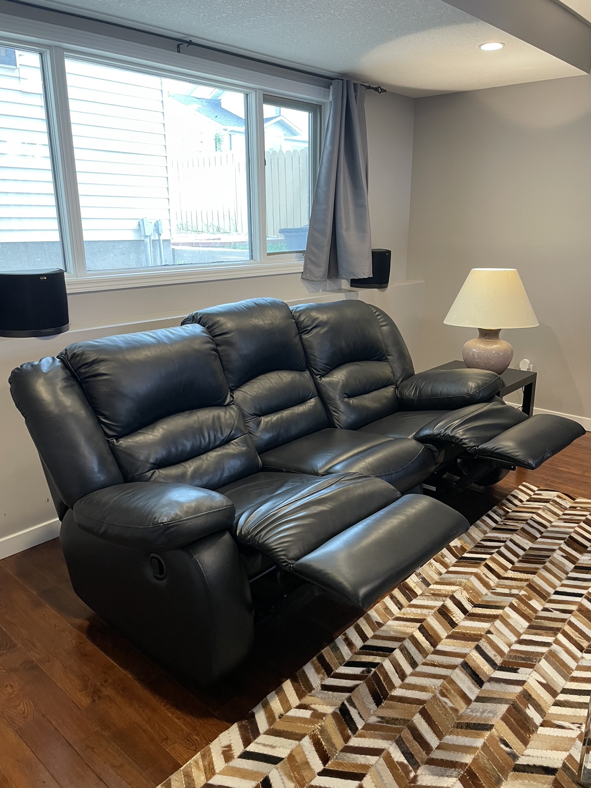 Black leather reclining sofa