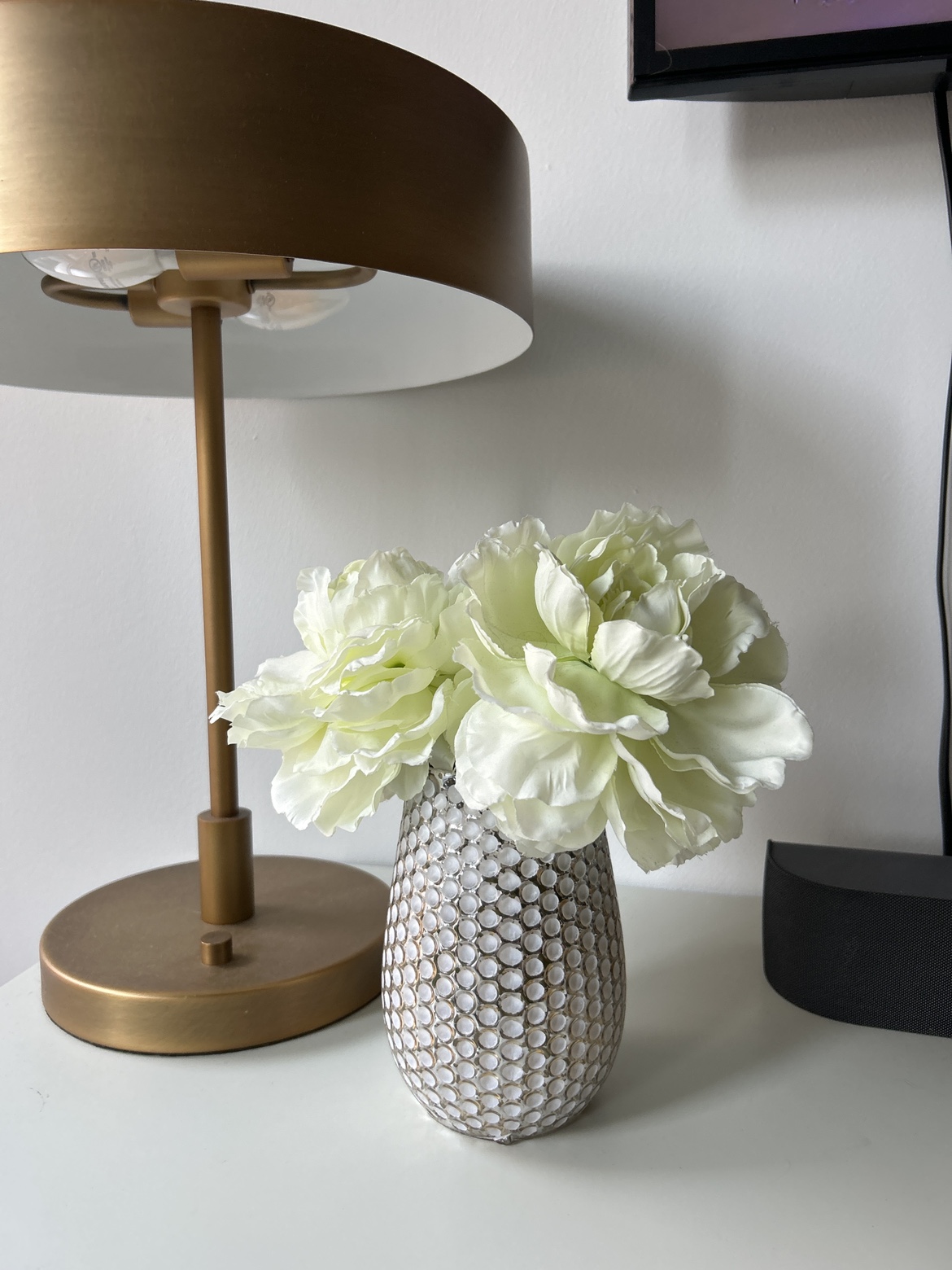Artificial peonies and vase