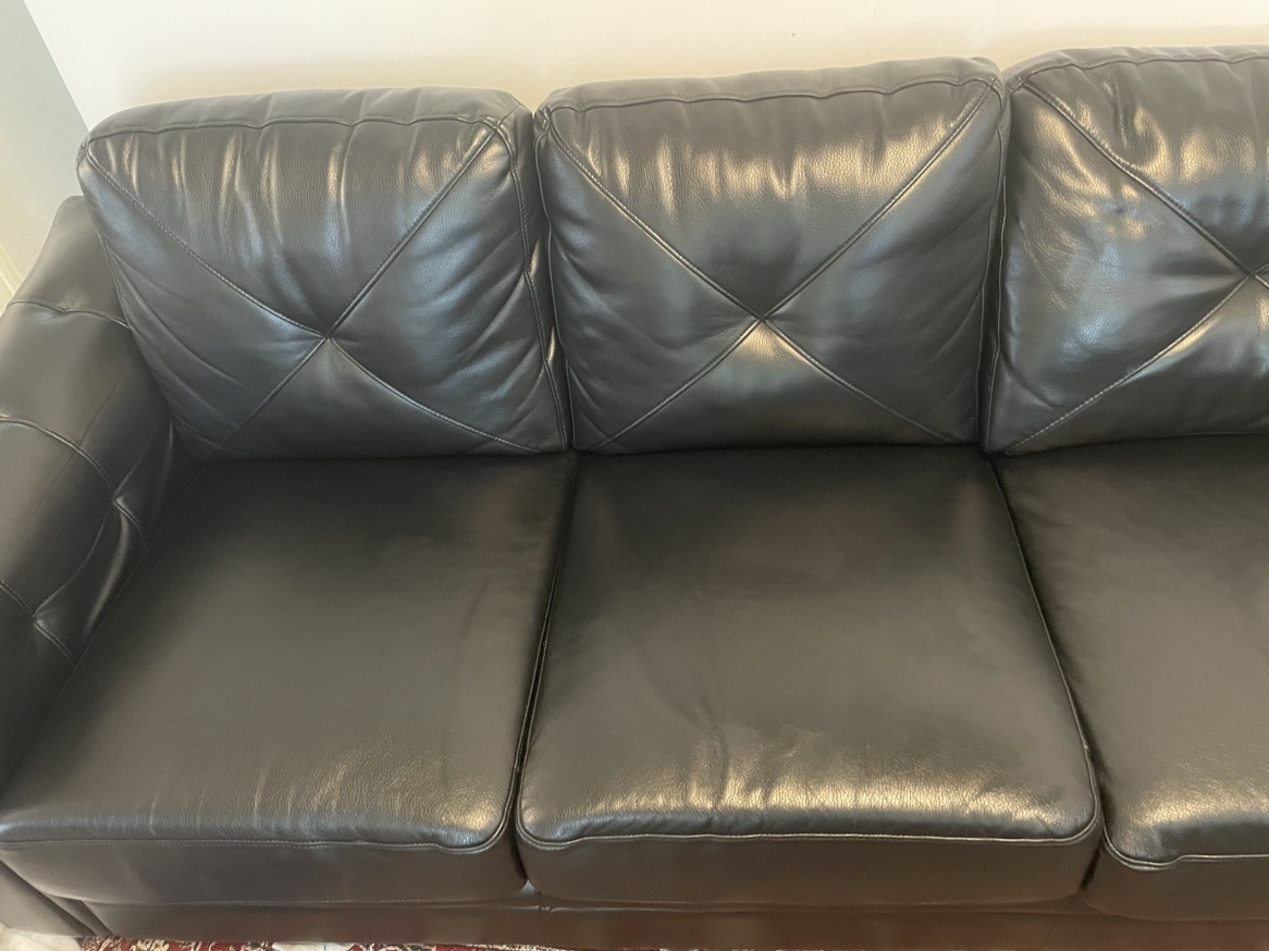 Black leather sofa in excellent condition